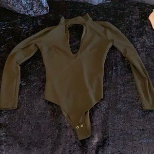 Clothing: black body suit